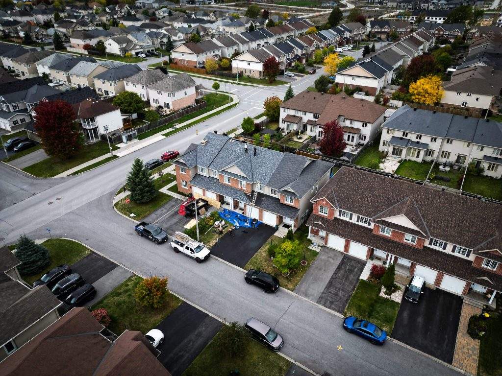 Aerial view of a Vanity Roofing team installing a residential roof in Gatineau
